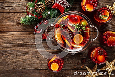 Christmas punch. Festive red cocktail, drink with cranberries and citrus fruits in a punch bowl and glasses Stock Photo