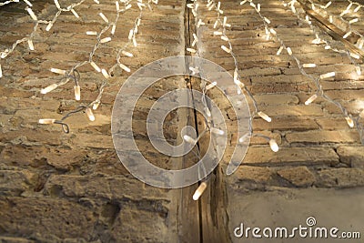 Christmas rain lights on handmade block wall in Sardinia Stock Photo