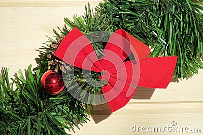 Christmas red bow on green New Year tree branch Stock Photo