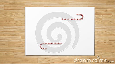 Christmas red candy cane on wooden table. Stock Photo