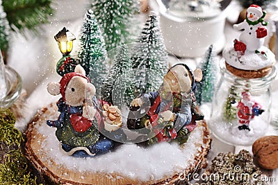 Christmas retro decoration with winter scene of two mice figurines Stock Photo