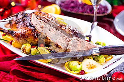 Christmas roast duck served on a festive table Stock Photo