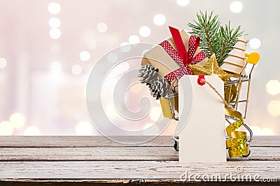 Christmas sales shopping cart concept with gift box and decoration Stock Photo