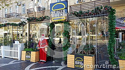 Christmas Santa Claus at the entrance of the restaurant Editorial Stock Photo