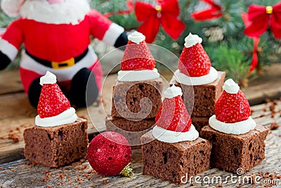 Christmas Santa hat brownies dessert idea , cake brownie with cr Stock Photo