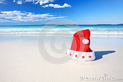 Christmas Santa hat on sunny beach in Australia Stock Photo