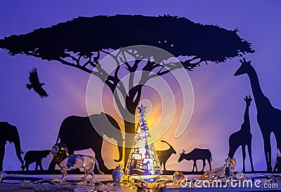 Christmas scene with silhouette of Elephants and Giraffe Stock Photo