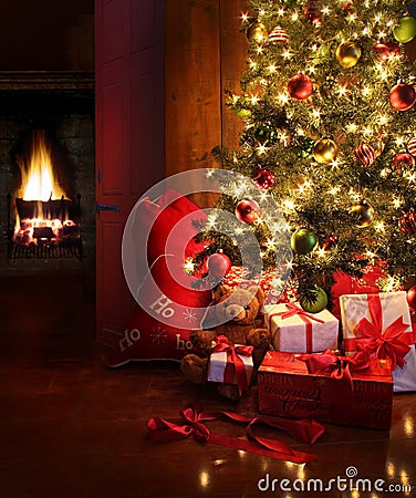 Christmas scene with tree and fire in background Stock Photo