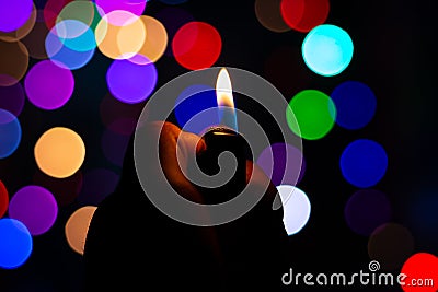 christmas scenery silent night candle light on dark with colorful blur background Stock Photo