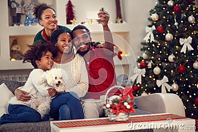 Christmas selfie - Afro American family making selfie Stock Photo