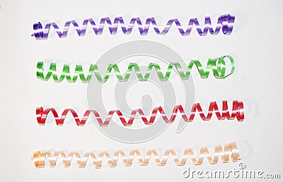 Christmas serpentine of different colors on a white background Stock Photo