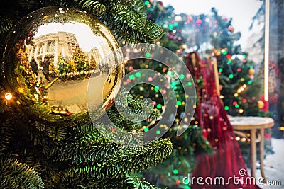Christmas shiny ball on the Christmas tree at the fair Stock Photo