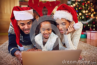 Christmas shopping online- family surfing on computer Stock Photo