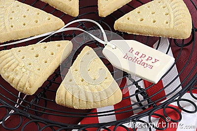 Christmas shortbread triangle cookies on vintage baking rack - closeup. Stock Photo