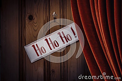 Christmas Sign HoHoHo Against Curtained Door Stock Photo