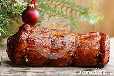 Christmas smoked ham under fir branch Stock Photo