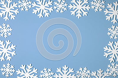 Christmas snowflake border frame on blue background. Xmas minimal texture with copy space. top view Stock Photo