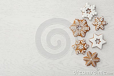 Christmas snowflake shaped cookies on white wooden table, flat lay. Space for text Stock Photo