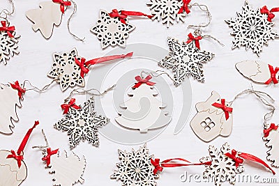 Christmas soft beige wooden snowflakes on a wood white background. Stock Photo