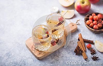 Christmas Spicy Apple Cider or punch beverage. Seasonal mulled Traditional autumn, winter drinks and cocktails with apple, Stock Photo