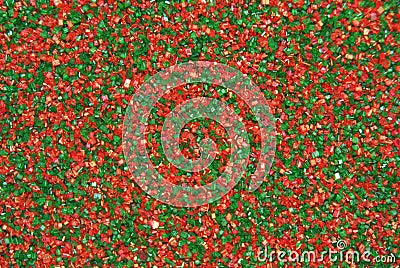 Christmas Sprinkles Candy Sugar in Red and Green Background Stock Photo