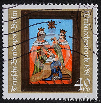 Christmas stamp printed in the Germany shows birth of Jesus Christ, adoration of the Magi Editorial Stock Photo