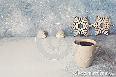 Christmas stars, candles and cuo of coffee on a blue stone background Stock Photo