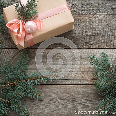 Christmas still life of giftbox with pink ribbon and decor. Seasonal rustic Christmas border composed of decorative gifts, ornamen Stock Photo