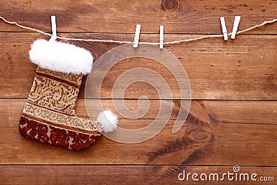 Christmas stocking sock hanging on brown wooden background, merry xmas and happy New year card, copy space, top view Stock Photo