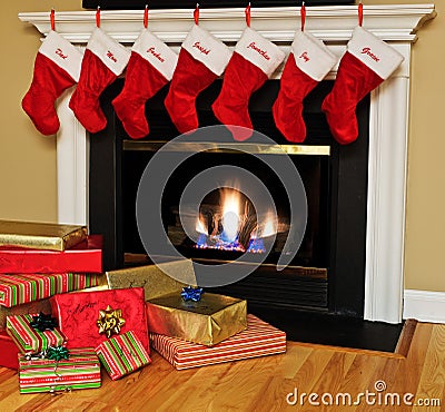 Christmas stockings by the fireplace Stock Photo