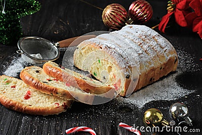 Christmas Stollen. Traditional Sweet Fruit Loaf with Icing Sugar. Xmas Holiday Table Setting, Decorated with Mini Tree Christmast Stock Photo