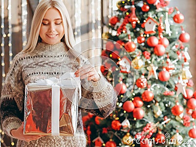 Christmas surprise lady sweater gift box fir tree Stock Photo