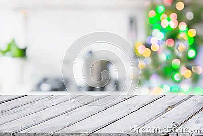 Christmas table background with christmas tree in kitchen out of focus. Background for display your products. Stock Photo