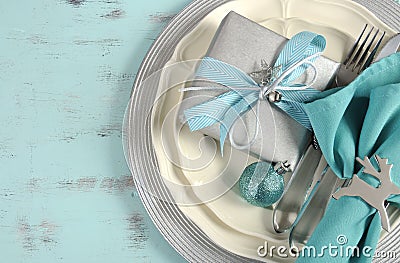 Christmas table place settings in aqua blue, silver and white Stock Photo