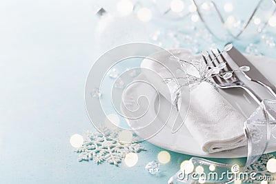 Christmas table setting for holiday dinner. Bokeh effect. Empty space for menu Stock Photo