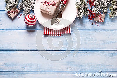 Christmas table setting. White plate, knife and fork, napkin and Stock Photo