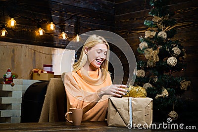 Christmas time. Celebration. Fashion portrait of girl indoors with Christmas tree. True Emotions. Happy emotion Stock Photo