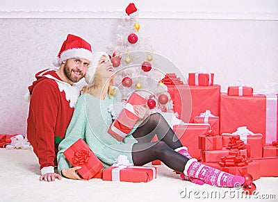Christmas is time for giving. Couple in love enjoy christmas holiday celebration. Family prepared christmas gifts Stock Photo