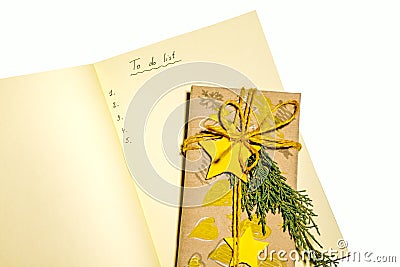 Christmas To Do List with yellow christmas decorations isolated on white background Stock Photo