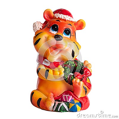 Christmas toy statuette small orange tiger cub in a hat Stock Photo