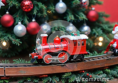 A Christmas Toy Train Under A Tree, With A Front Angle. Generative AI Stock Photo