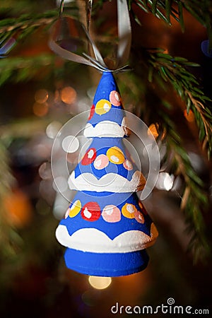 Christmas Toy wooden brightly colored Christmas tree hanging on Stock Photo