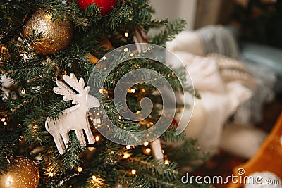 Christmas toy wooden deer on the Christmas tree Stock Photo