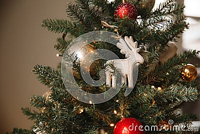 Christmas toy wooden deer on the Christmas tree Stock Photo