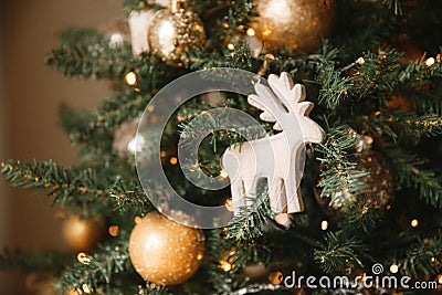 Christmas toy wooden deer on the Christmas tree Stock Photo
