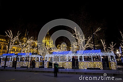 Christmas tram in Budapest, with the Parliament in Editorial Stock Photo