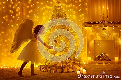 Christmas Tree and Angel Child with Candle, Girl and Presents Stock Photo