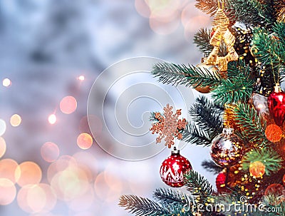 Christmas tree background and Christmas decorations with snow, blurred, sparking, glowing. Happy New Year and Xmas Stock Photo