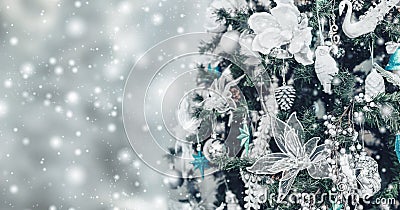 Christmas tree background and Christmas decorations with snow, blurred, sparking, glowing. Stock Photo