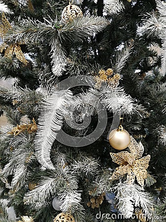 Christmas tree with balls close-up. Silvery golden branches will be a good background. Stock Photo